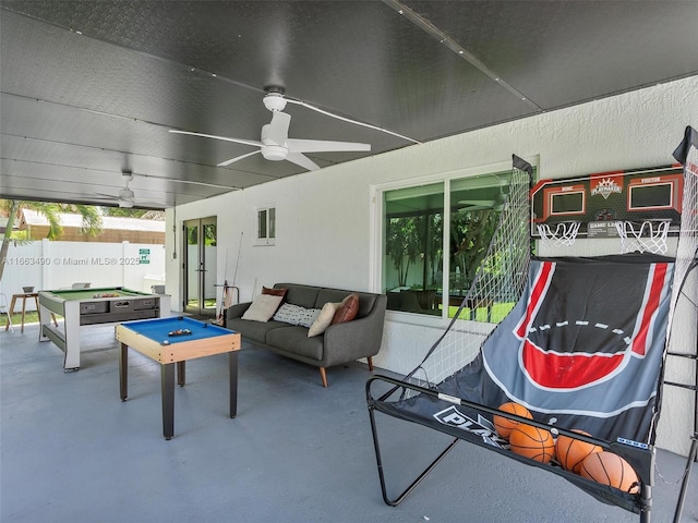 exterior space with ceiling fan, a jacuzzi, an outdoor hangout area, and fence