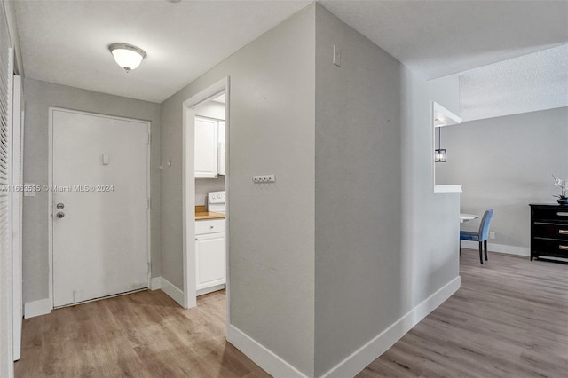 hallway featuring light hardwood / wood-style flooring