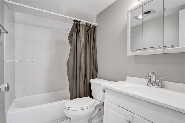 full bathroom with toilet, vanity, and shower / tub combo