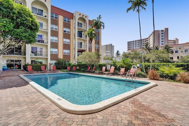 view of swimming pool featuring a patio area