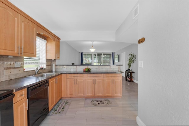 kitchen with hanging light fixtures, kitchen peninsula, sink, tasteful backsplash, and black dishwasher