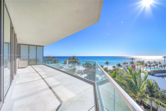 balcony featuring a water view