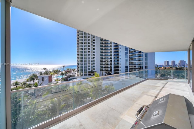 balcony featuring a water view