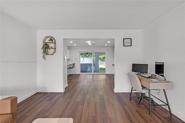 office featuring a textured ceiling and dark hardwood / wood-style floors