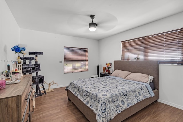 bedroom featuring wood-type flooring and ceiling fan