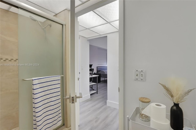 bathroom featuring walk in shower and hardwood / wood-style flooring