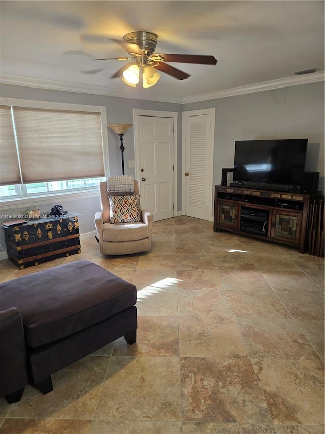 living room with crown molding and ceiling fan