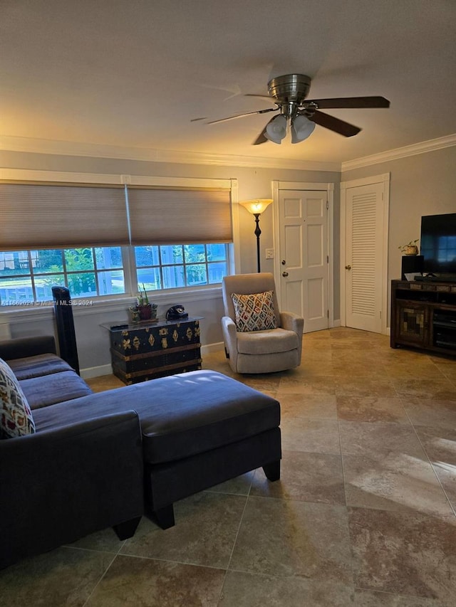 living room with ceiling fan and ornamental molding