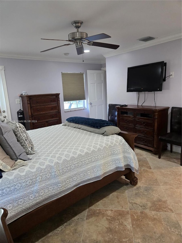 bedroom featuring ceiling fan and crown molding