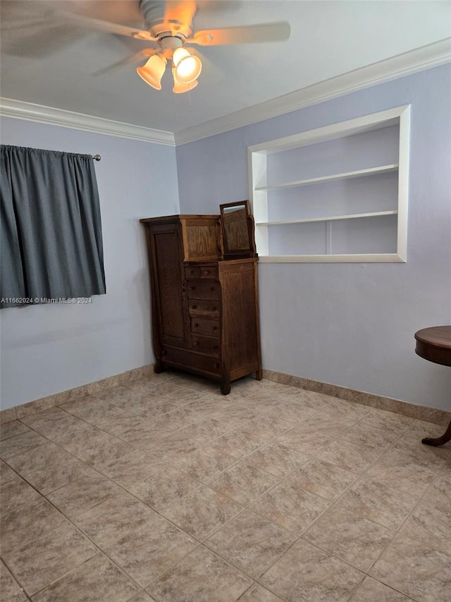 spare room with ornamental molding and ceiling fan