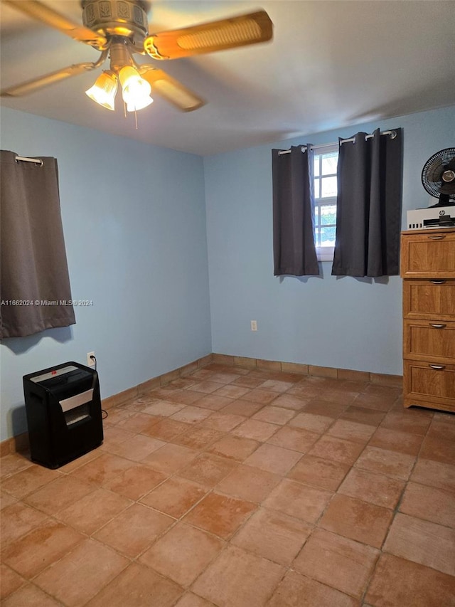 spare room featuring ceiling fan