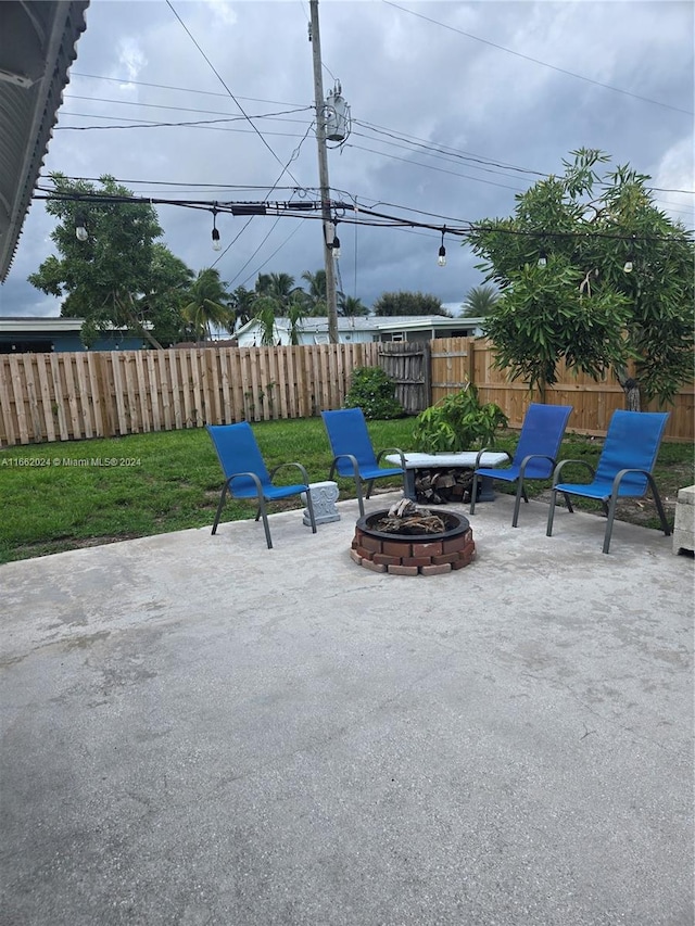 view of patio with a fire pit