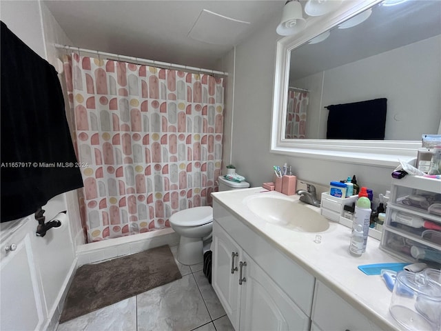 bathroom featuring curtained shower, tile patterned flooring, vanity, and toilet