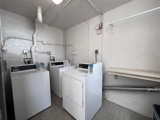 laundry area featuring washing machine and clothes dryer