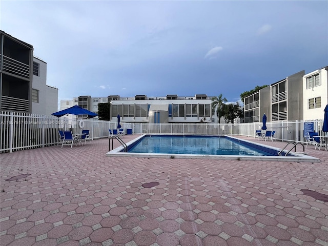 view of swimming pool featuring a patio area