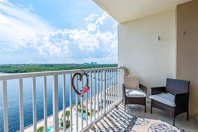 balcony featuring a water view