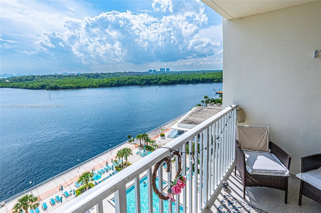 balcony featuring a water view