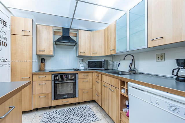 kitchen with light tile patterned floors, sink, oven, wall chimney range hood, and dishwasher