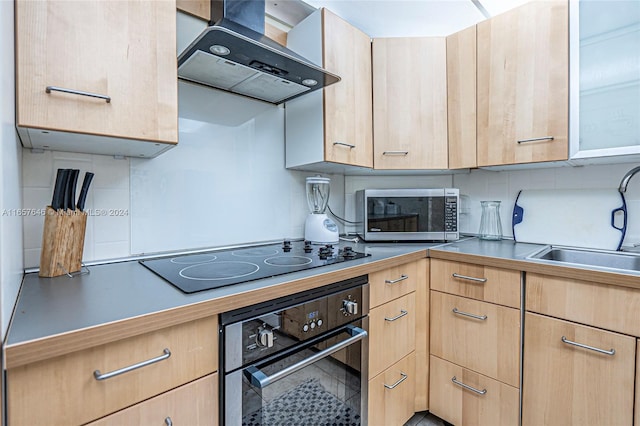 kitchen featuring appliances with stainless steel finishes, backsplash, light brown cabinetry, range hood, and sink