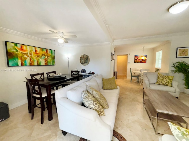 living room with ornamental molding and ceiling fan