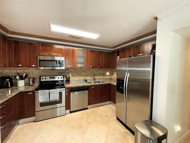 kitchen with stainless steel appliances, sink, light stone counters, tasteful backsplash, and crown molding