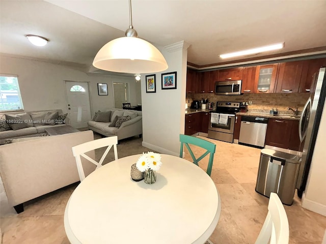 dining area with sink and light tile patterned floors