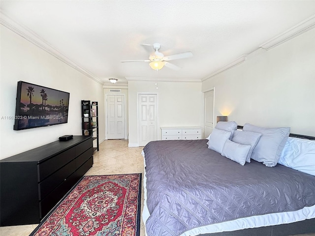 tiled bedroom with ceiling fan and crown molding