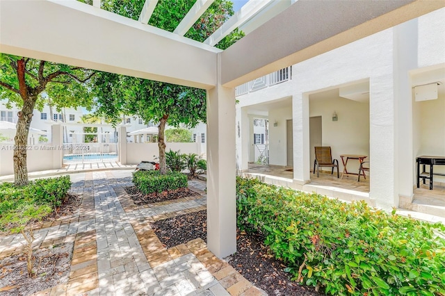 view of patio / terrace with a fenced in pool