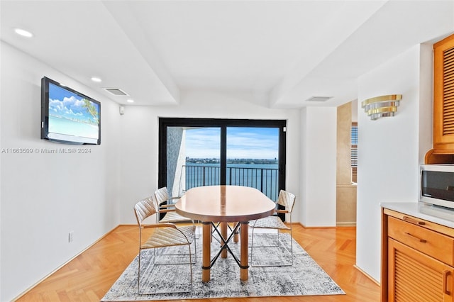 dining area with light parquet floors