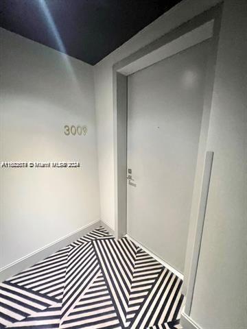 45 SW 9th St Unit 3009, Miami, FL 33130 - detailed view of carpet floors and baseboards