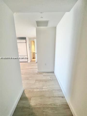 corridor featuring light hardwood / wood-style floors