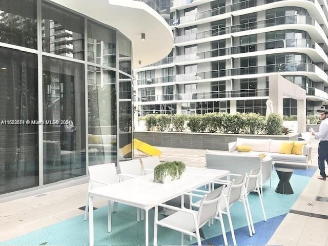 45 SW 9th St Unit 3009, Miami, FL 33130 - view of patio / terrace with an outdoor hangout area