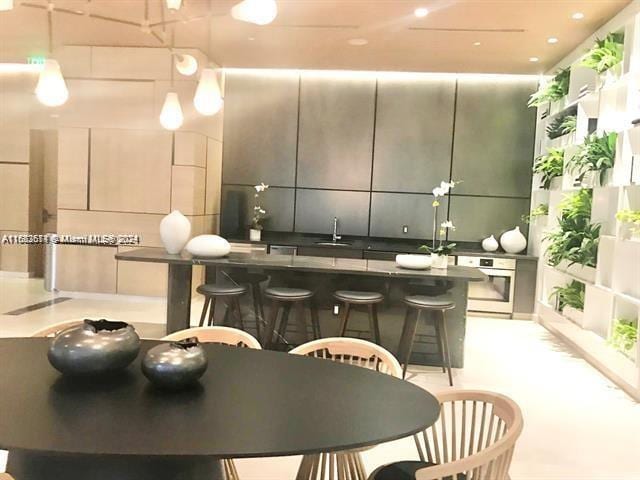 45 SW 9th St Unit 3009, Miami, FL 33130 - bar featuring stainless steel oven and a sink