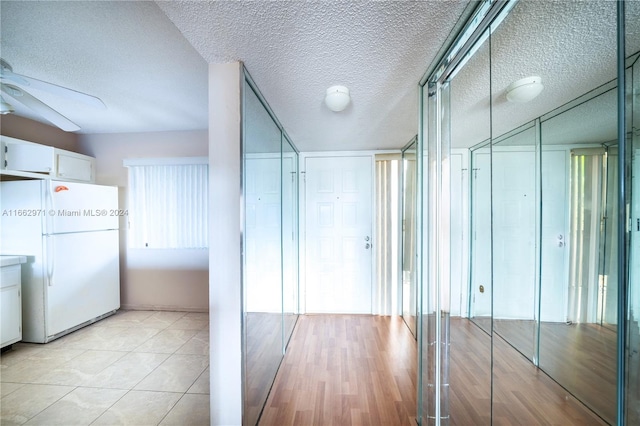 interior space featuring ceiling fan and light hardwood / wood-style flooring