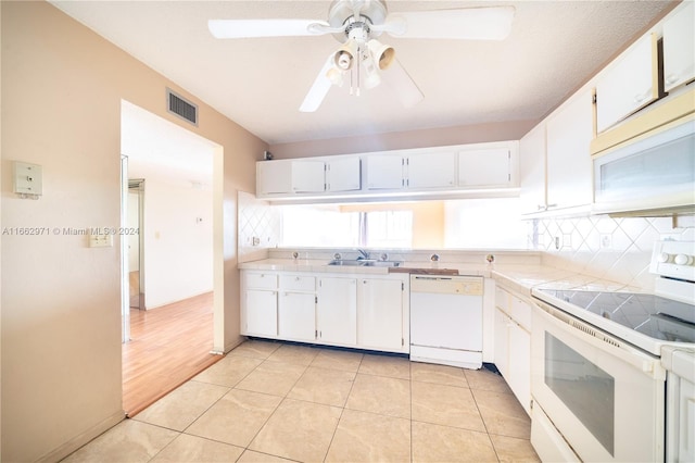 kitchen with ceiling fan, white cabinets, sink, white appliances, and light hardwood / wood-style floors