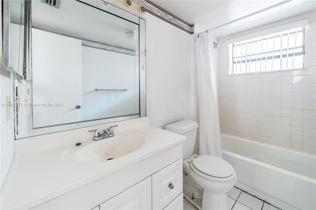 full bathroom featuring vanity, toilet, shower / bathtub combination with curtain, and tile patterned floors