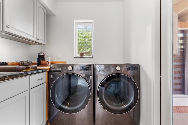 laundry room featuring cabinets and independent washer and dryer