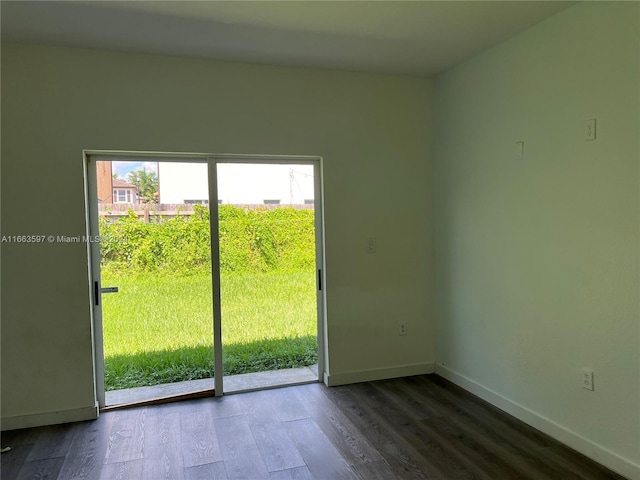 doorway to outside with hardwood / wood-style flooring and a wealth of natural light