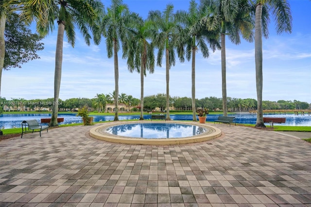 view of pool featuring a water view