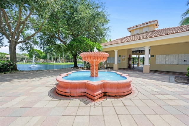 view of patio / terrace with pool water feature