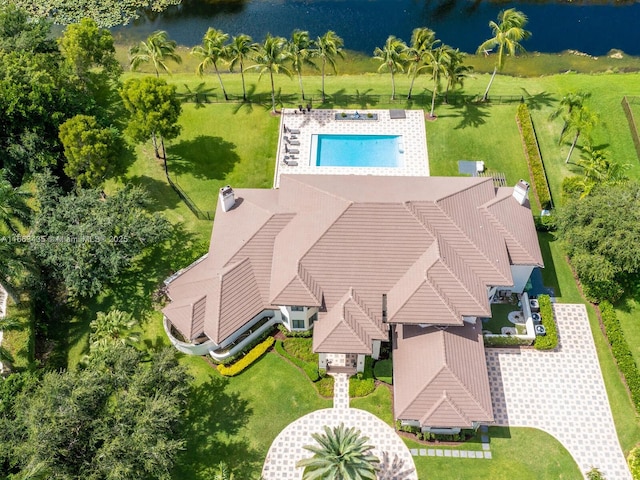 birds eye view of property with a water view