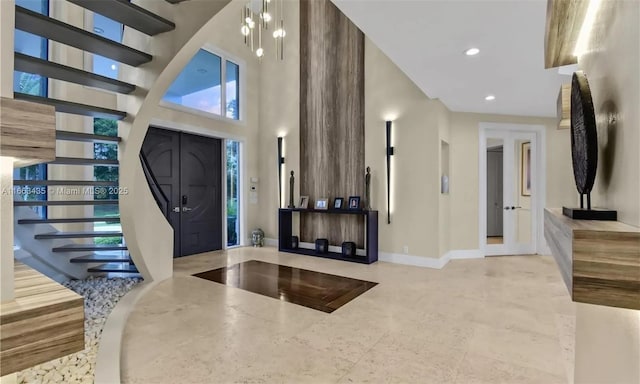 foyer entrance featuring a high ceiling