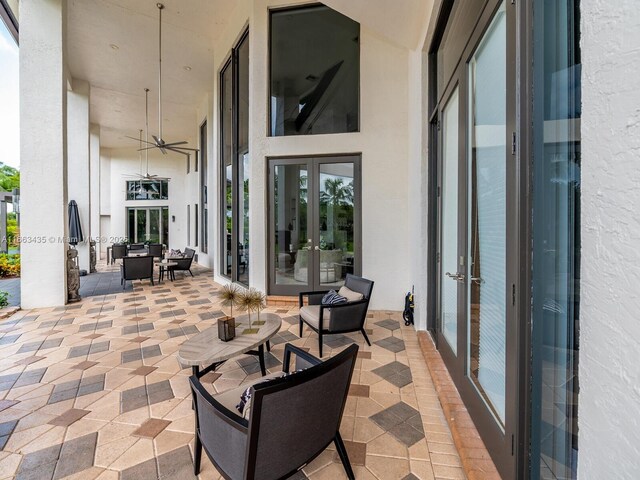 view of patio featuring ceiling fan and french doors