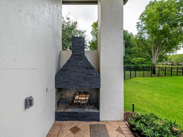 view of patio / terrace with an outdoor stone fireplace