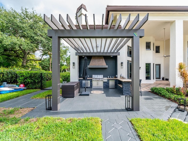 view of patio featuring area for grilling and exterior kitchen