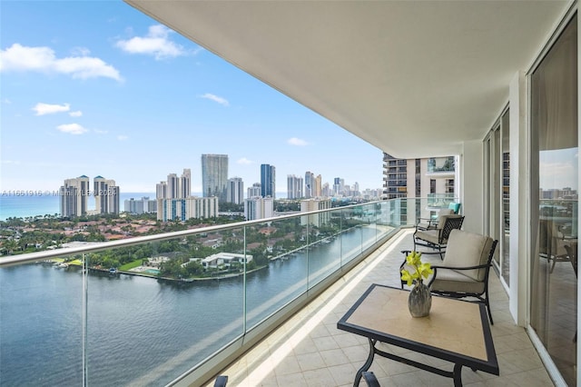 balcony featuring a water view