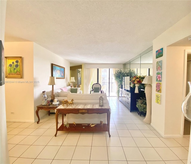 bedroom with light tile patterned flooring and a textured ceiling