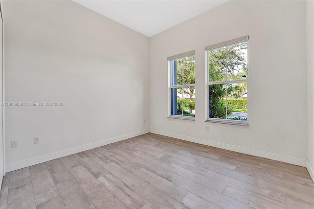 empty room with light hardwood / wood-style floors