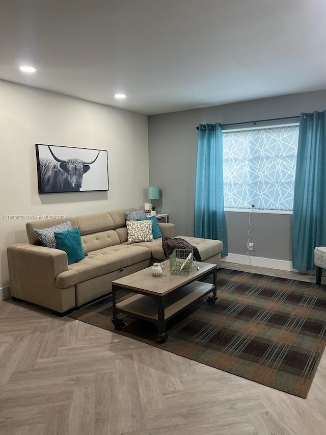 living room featuring parquet flooring