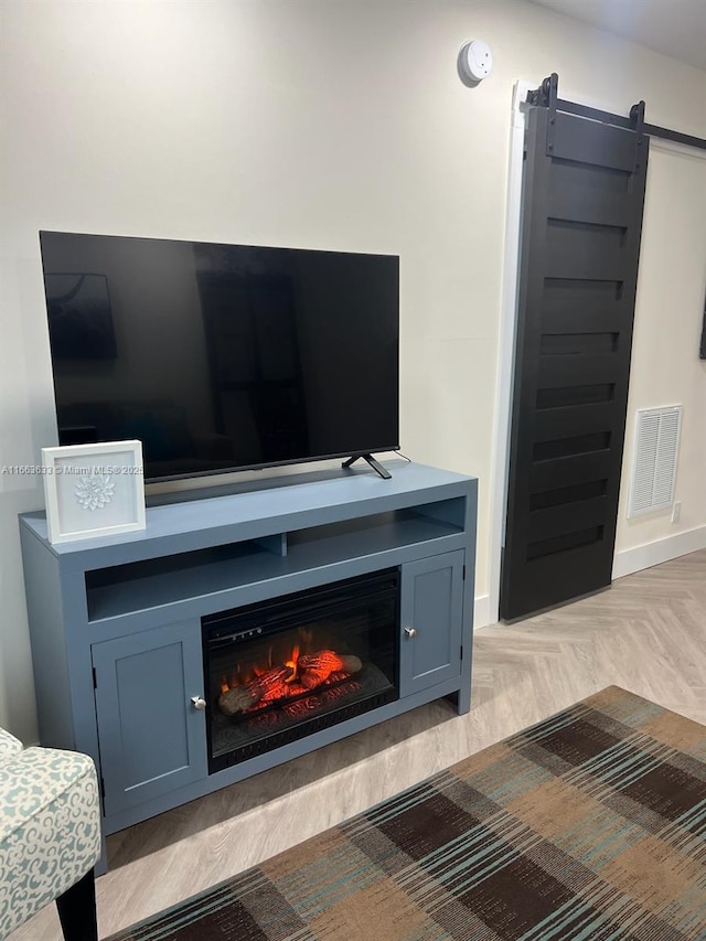 659 W Oakland Park Blvd Unit 218C, Oakland Park, FL 33311 - detailed view of a barn door, a smoke detector, and a glass covered fireplace